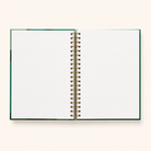 Close-up of the gold metal spiral binding on The Chronicles Statement notebook